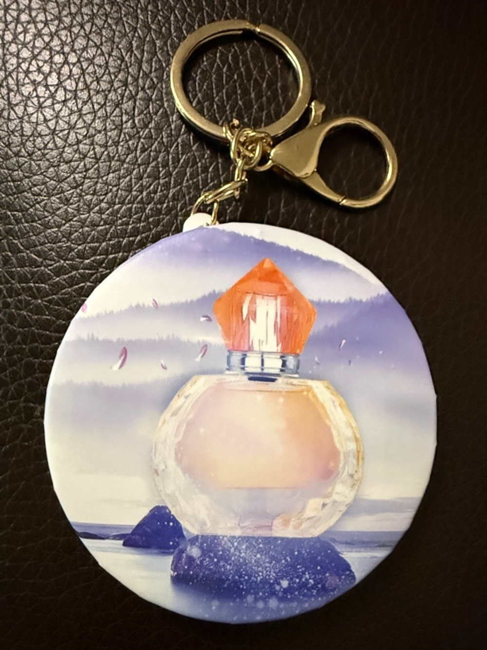 Purple Round Keychain Bag Charm with Perfume Bottle Design